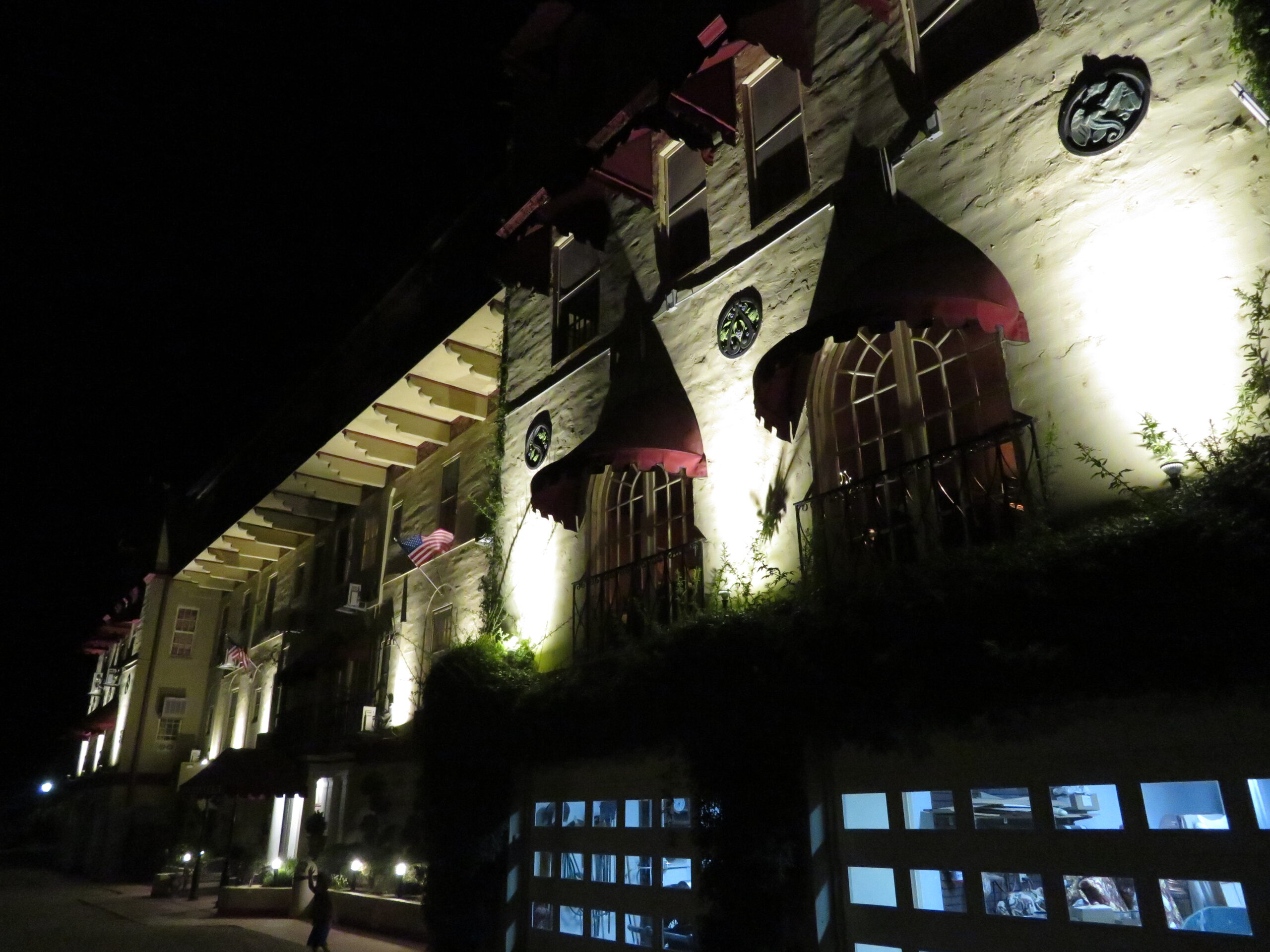 Haunted hotel lit up at night