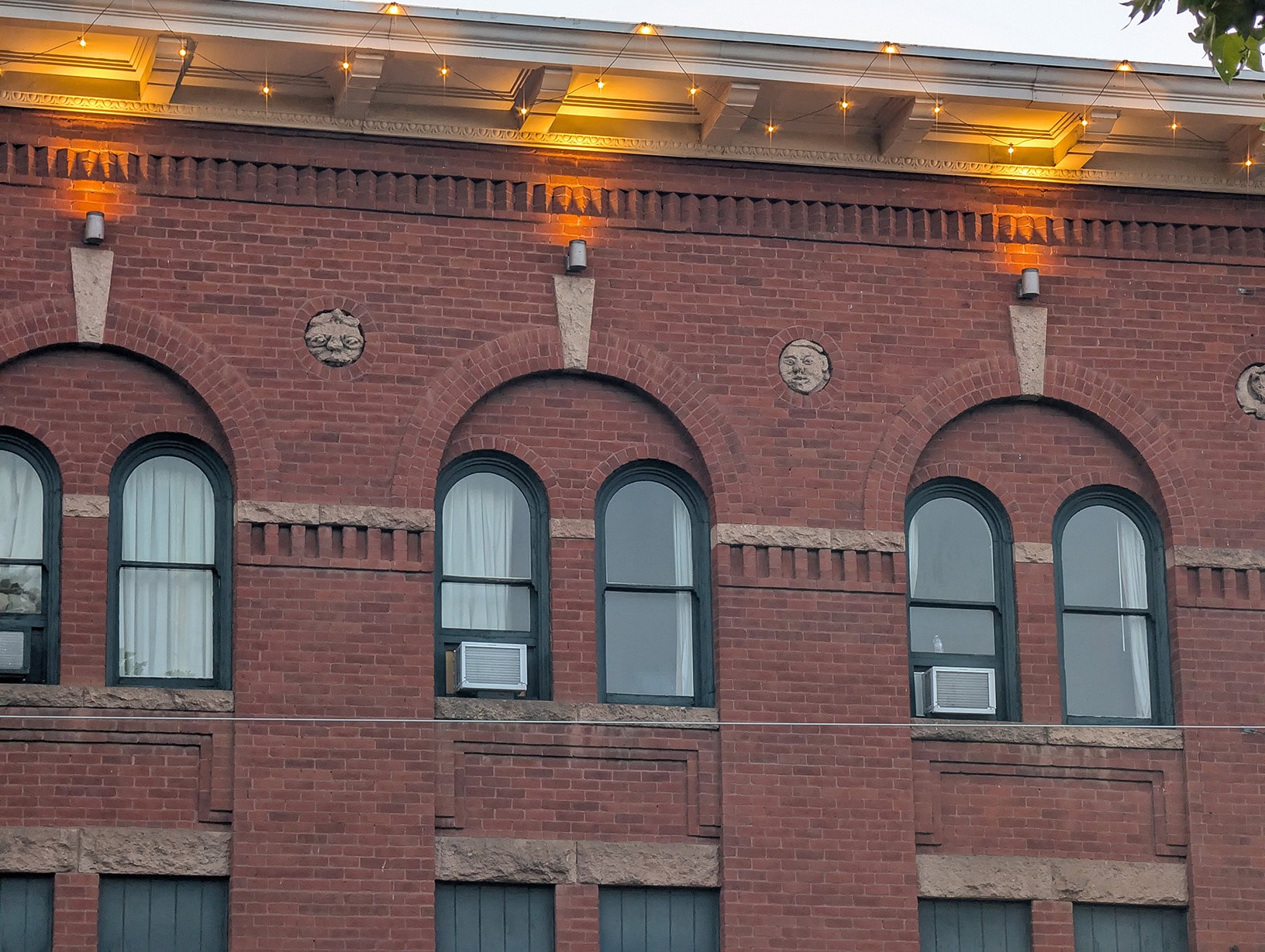 The carved gargoyle faces on the exterior of the Hotel St. Michael, just outside our Room 326 window