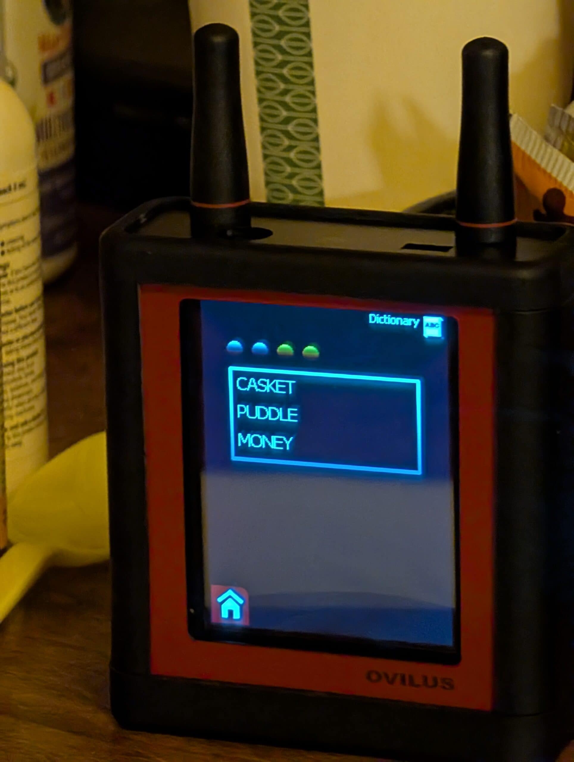 Ovilus screen showing the words Casket, Puddle, and Money during a session at the Hassayampa Inn