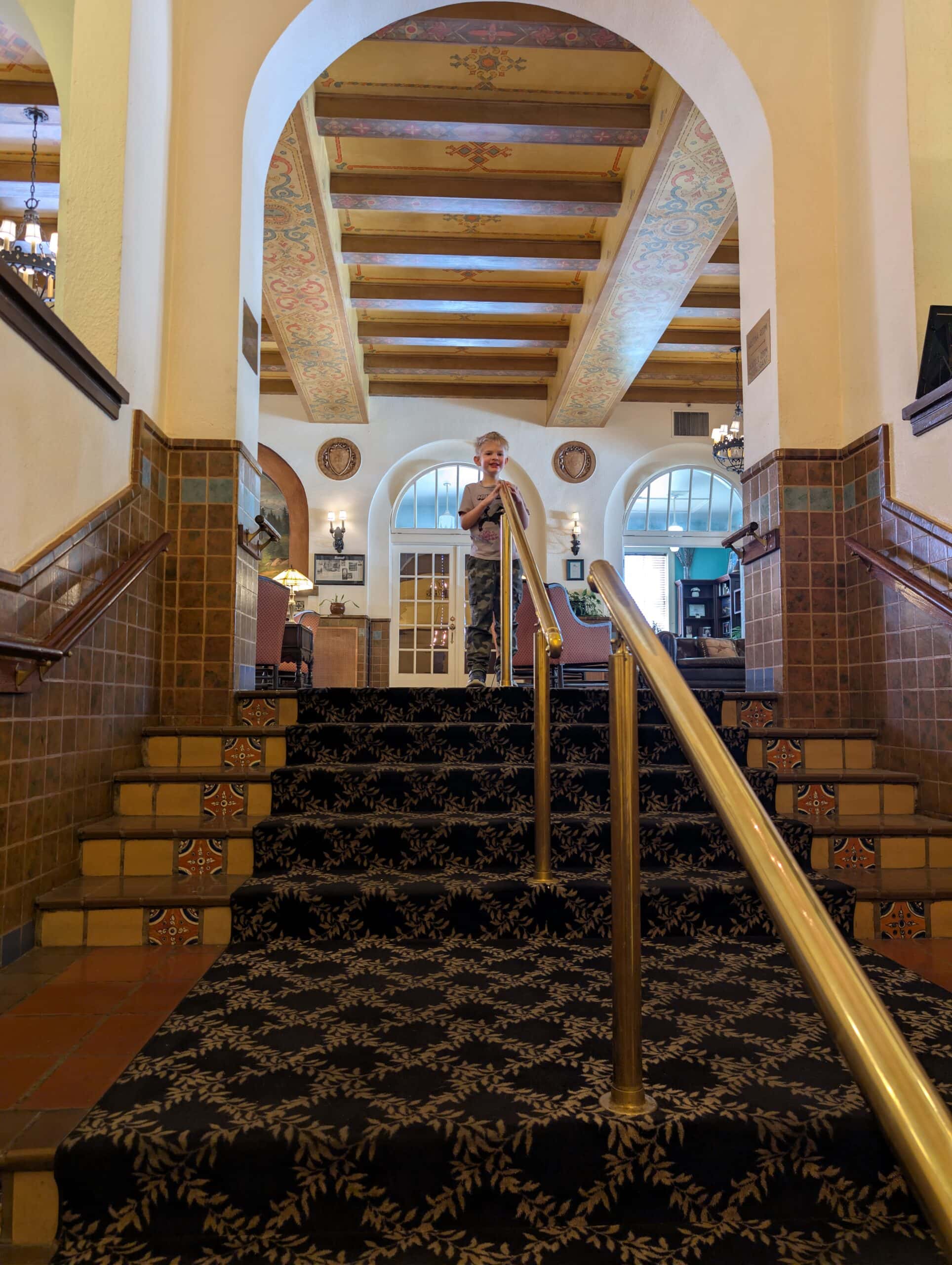 Reid at the top of one of the narrow wooden staircases at the Hassayampa Inn